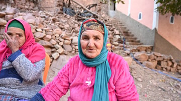 Woman wearing pink looking at camera