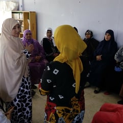 Two women speaking to each other