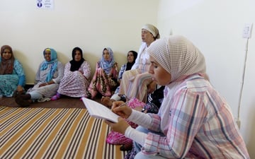 Women writing on a notepad