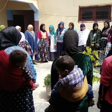Women holding hands in a circle