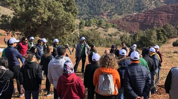 Volunteers listening to haf member speak