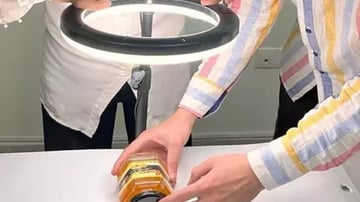 people inspecting honey