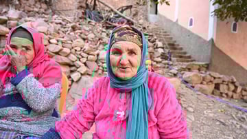 Woman wearing pink looking at camera