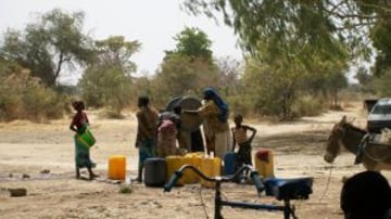 800px Balga February 2010 Women around the water pump 300x169