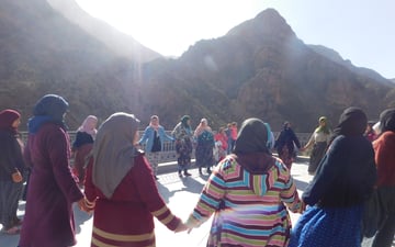 People holding hands in a circle