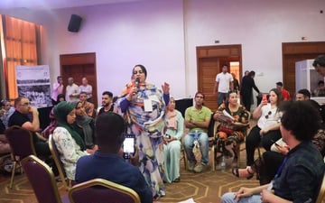 Women speaking into microphone