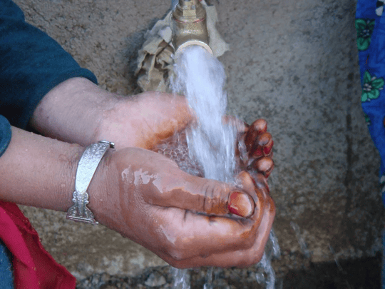 Hands cupping water