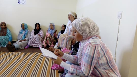 Women writing on a notepad