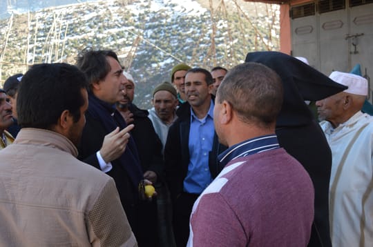 Yossef speaking with a group