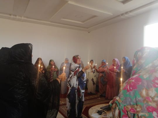 Women holding candles
