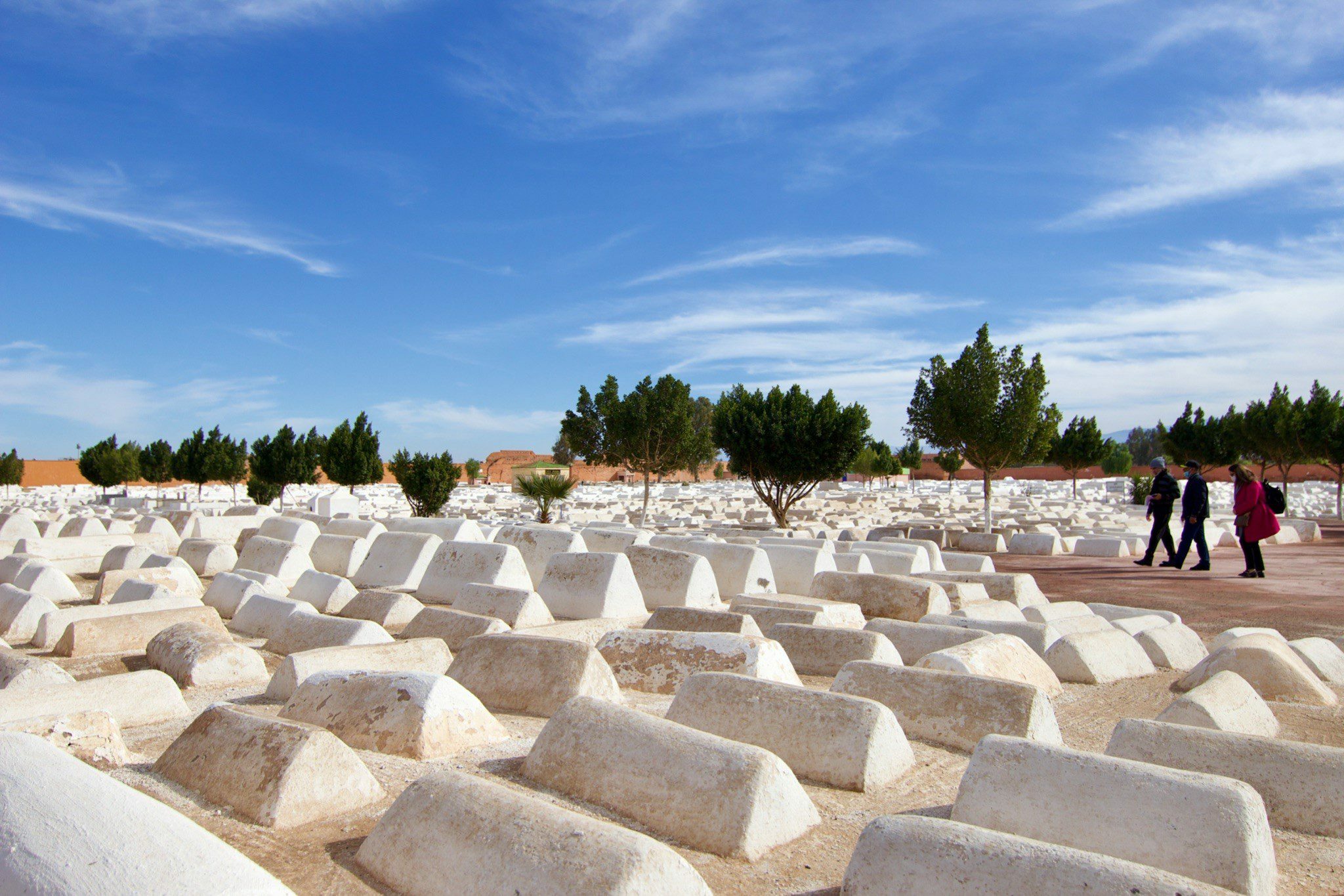 Jewish cemetery in Morocco expansive white graves under blue sky